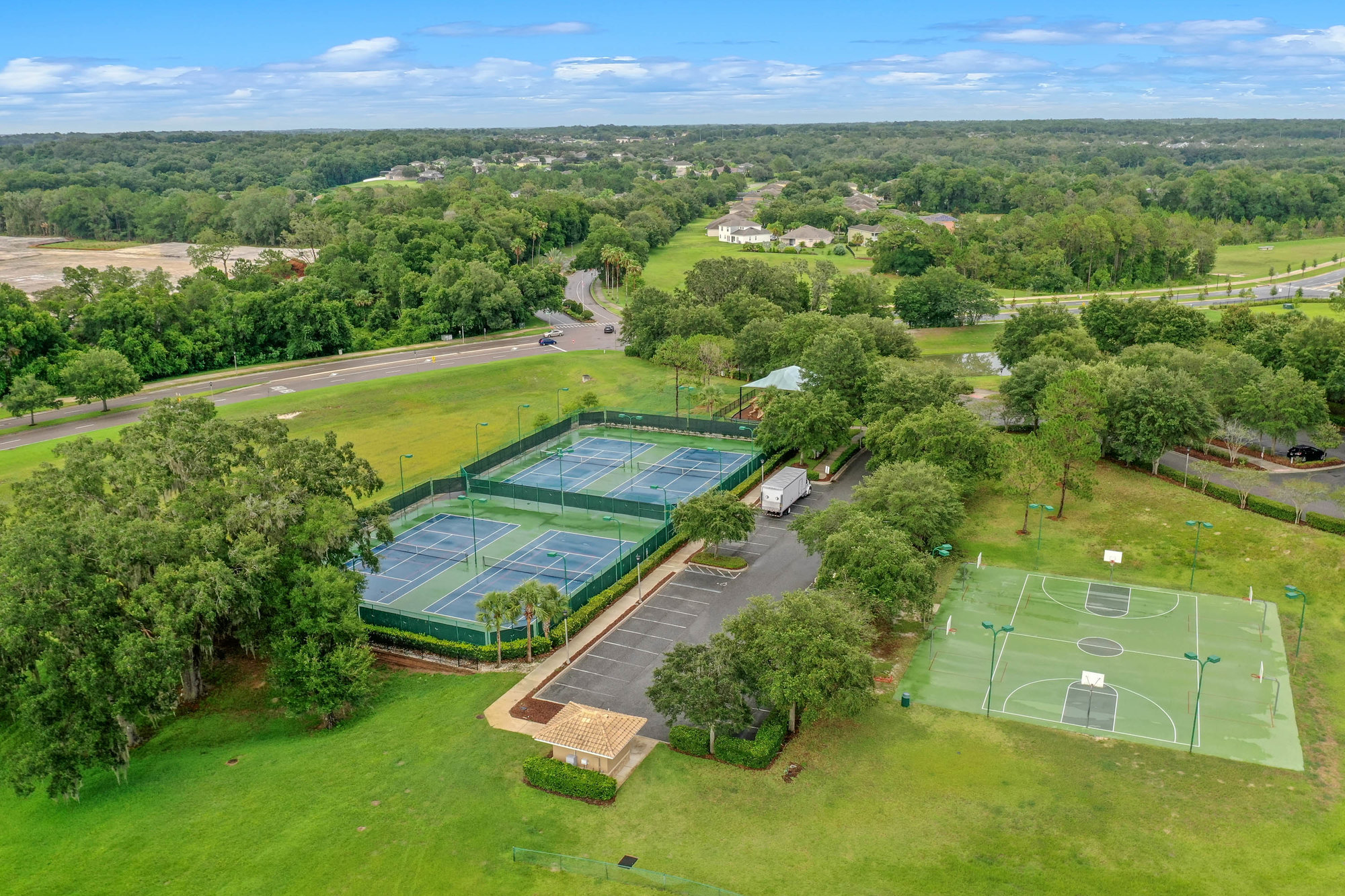 drone shot of tennis and basketball courts